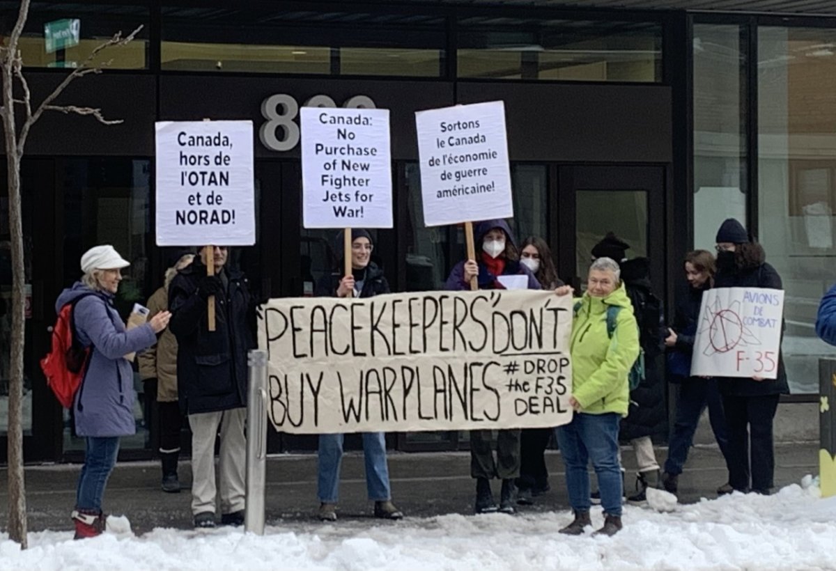 People protesting in front of Canada's Environment Minister Steven Guilbeault against the purchase of F-35 fighter jets. Friday January 6th, 2023.