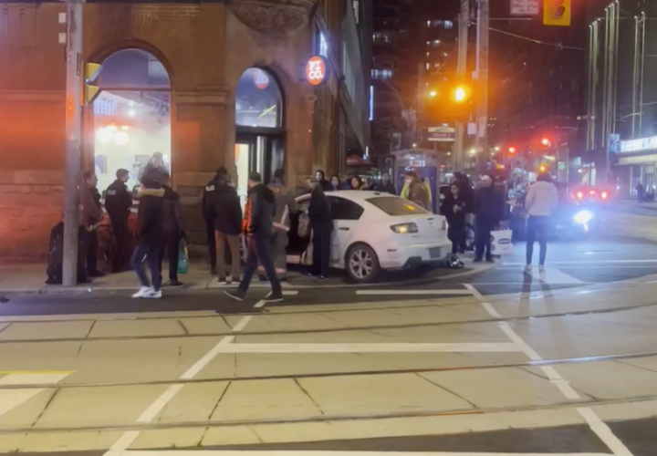 A car collided with a building in Toronto, officials say.