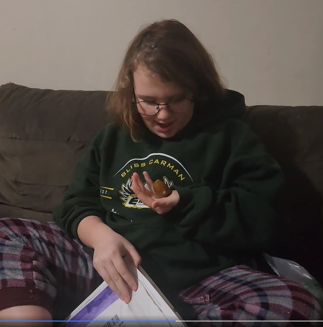 Georgia LeMesurier’s mom filmed her opening the package with her amber gem.