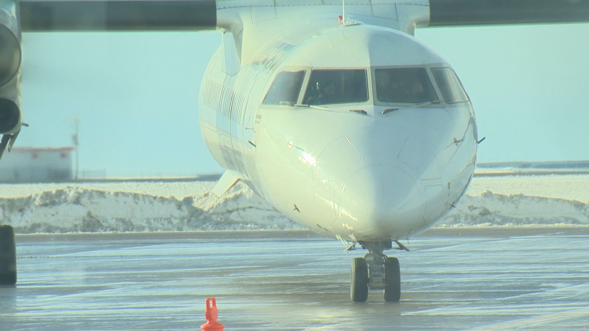 A plane sits ready to depart at Regina International Airport.