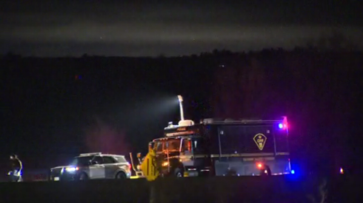 OPP at the scene along Highway 400 where a body was located on Wednesday.