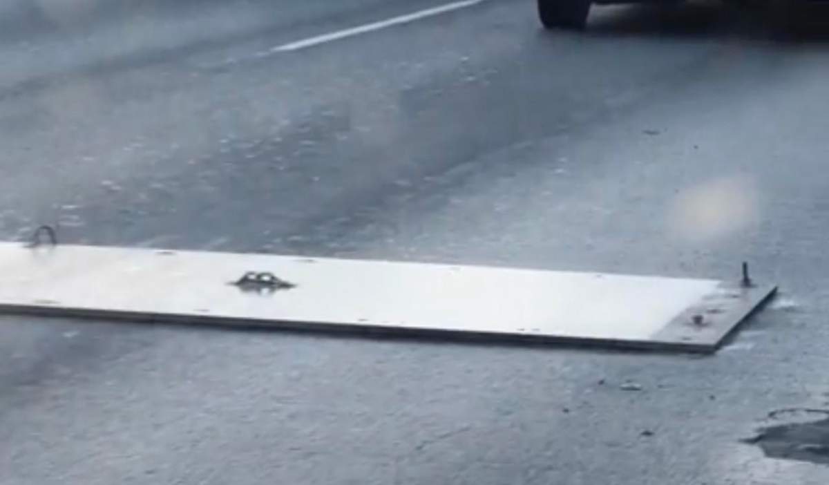 A bolt can be seen sticking from a plate on the Ironworkers Memorial Bridge deck.