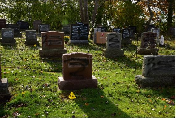 Belleville police have arrested a 20-year-old woman in connection with cemetery vandalism from Nov. 2021.