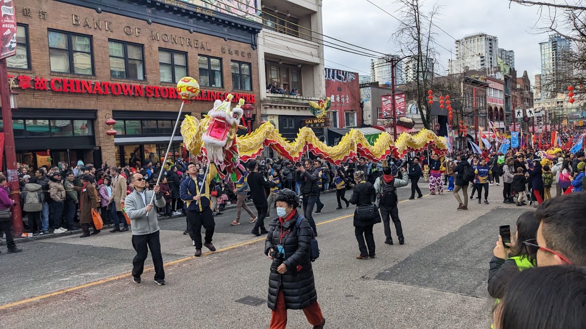 Crowds watch the Lunar New Year parade on Pender Street in Vancouver's Chinatown on Sun. Jan. 22, 2023.