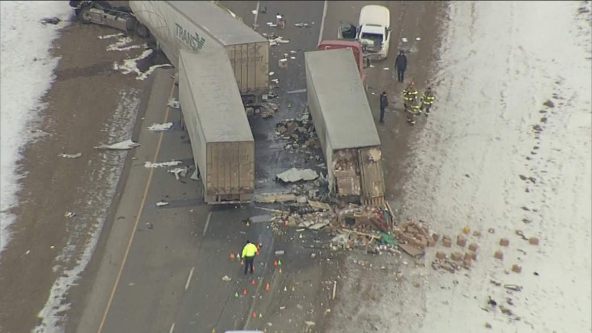 Emergency crews at the scene of a fatal crash involving what appears to be three semi and one car on Jan. 20, 2023.
