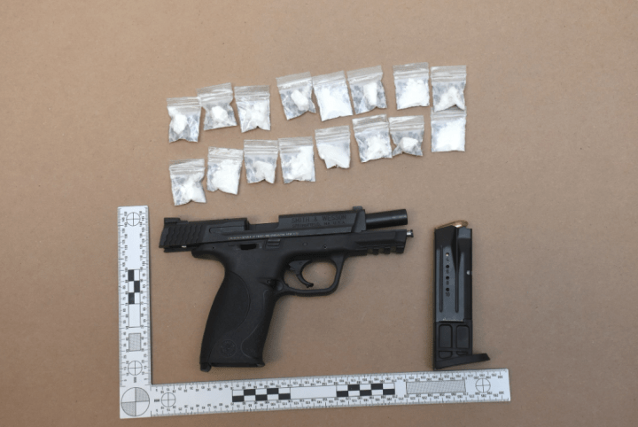 Police say a firearm and suspected cocaine was seized.