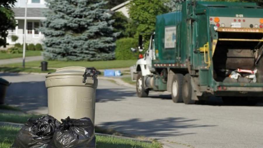 Garbage sits on the curb of a home in London, Ont.