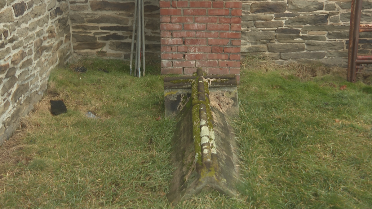 The church is surrounded on three sides by a cemetery, with some of the graves butting up against the church’s foundation.