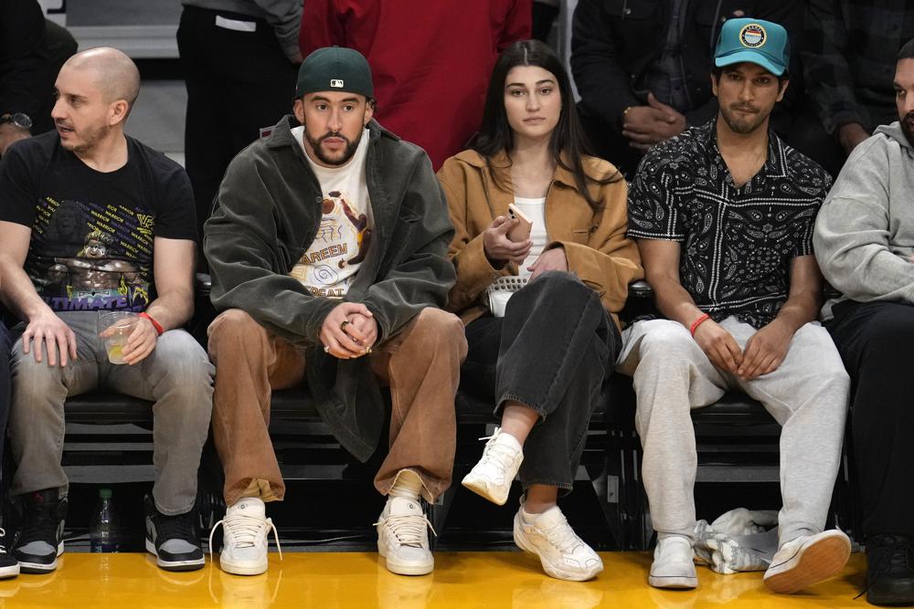Bad Bunny sits courtside.