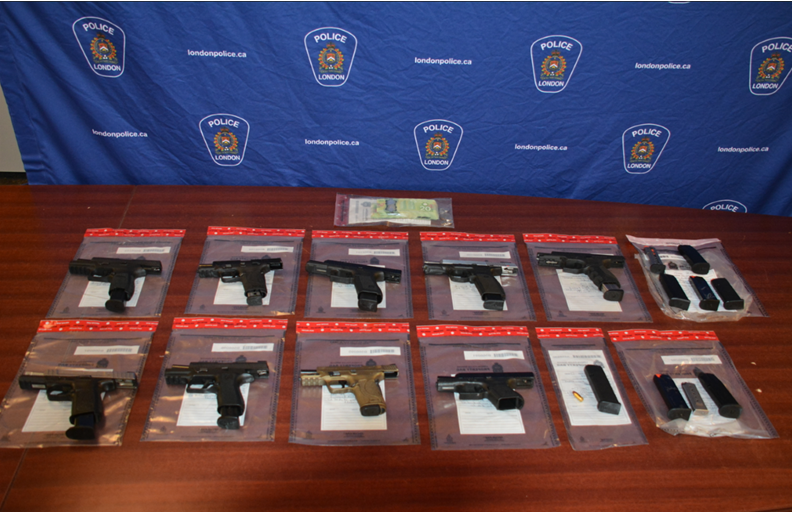 London police say they seized nine handguns from a man wanted on outstanding warrants. 
