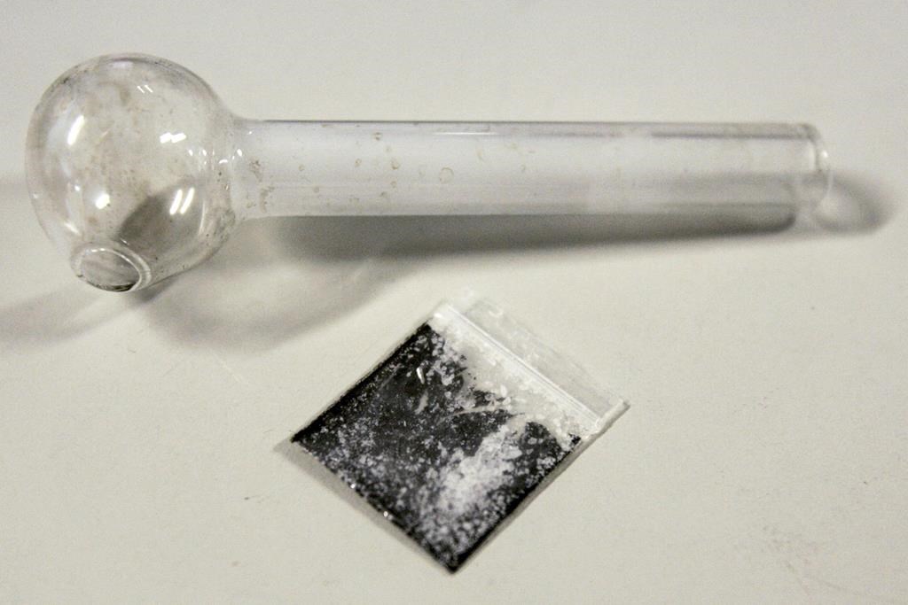 File photo of a pouch containing crystallized methamphetamine and a homemade pipe are shown March 21, 2006.