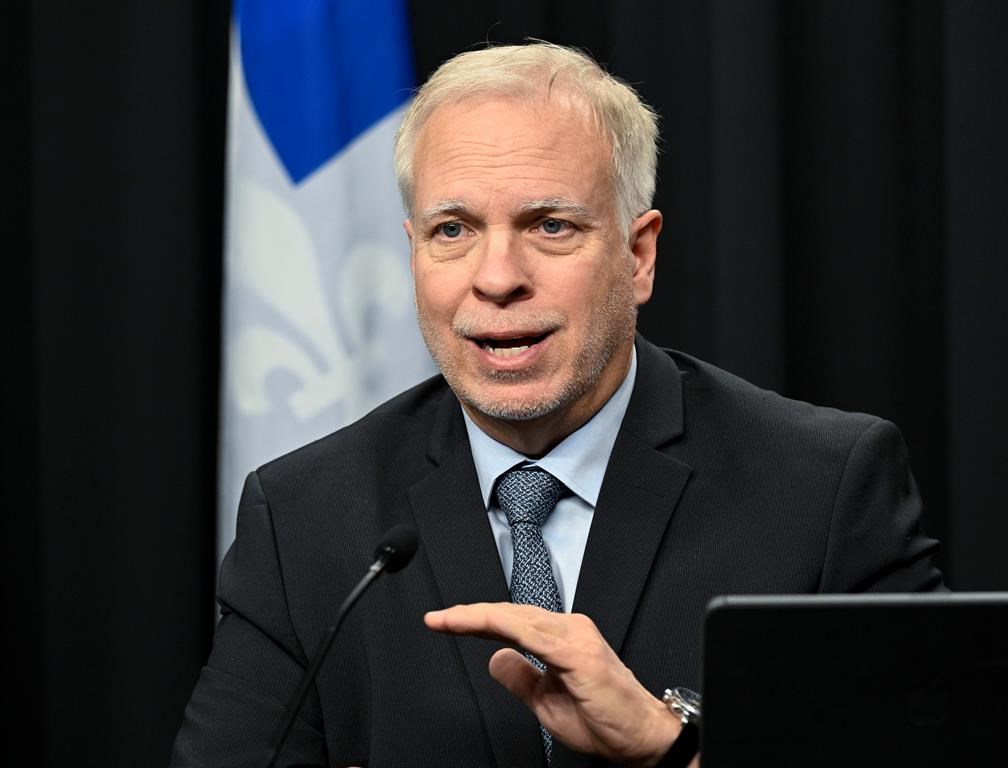Quebec public health director Dr. Luc Boileau speaks during a news conference, Wednesday, Dec. 14, 2022, in Quebec City. Quebec's Health Department says only residents who are considered at-risk for severe COVID-19 – and who haven't already been infected – should get a booster dose.
