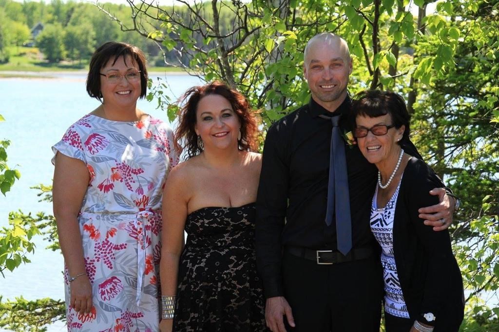 Kimberley DeWolfe (left to right), Jennifer DeWolfe, Mark DeWolfe and their mother, Diane Breen, are shown in a family handout photo. For the daughters of Diane Breen, the enduring tragedy of their mother’s death following an eight-hour wait at a Nova Scotia ER is not knowing what lessons were learned.
