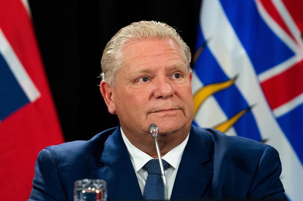 Ontario Premier Doug Ford listens to members of the media during a press conference in Ottawa, on Tuesday, Feb. 7, 2023. Ford believes the federal government will accept his recommendations on sustainability of a new health-care deal.