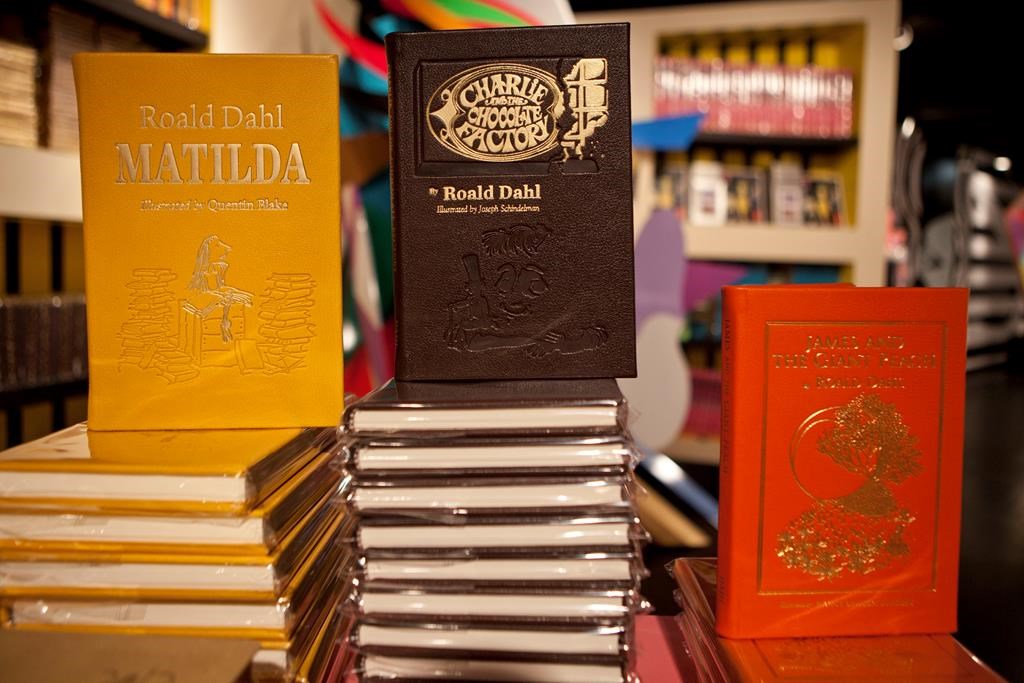 FILE - Books by Roald Dahl are displayed at the Barney's store on East 60th Street in New York on Monday, Nov. 21, 2011. Critics are accusing the publisher of Roald Dahl’s classic children’s books of censorship after it removed colorful language from stories such as “Charlie and the Chocolate Factory” and “Matilda” to make them more acceptable to modern readers.
