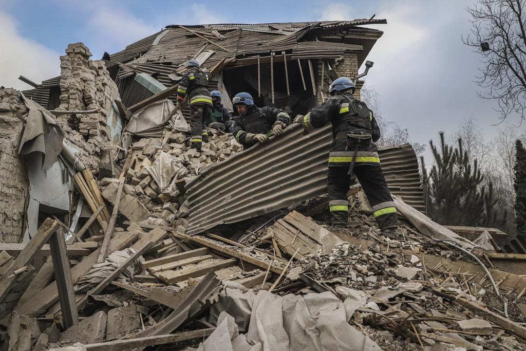 FILE - Ukrainian firefighters work at a damaged hospital maternity ward in Vilniansk, Zaporizhzhia region, Ukraine, Wednesday, Nov. 23, 2022.