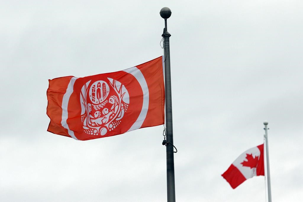 The Survivors’ Flag hangs to honour Indigenous Peoples who were forced to attend residential schools, on the grounds of the legislature in Victoria, B.C., on Wednesday, Sept. 28, 2022. On Tuesday, Tseshaht First Nation announced the preliminary results of an 18-month research-and-scanning effort to identify those who died at the Alberni Indian Residential School (AIRS), which operated from 1900 to 1973. THE CANADIAN PRESS/Chad Hipolito.