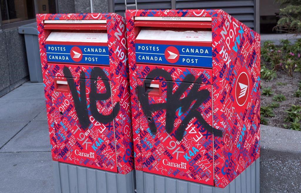 Canada Post says a spike in vandalism has put many of its Toronto mailboxes out of commission. A vandalized Canada Post mailbox is seen Tuesday, May 31, 2016 in Montreal. THE CANADIAN PRESS/Paul Chiasson.