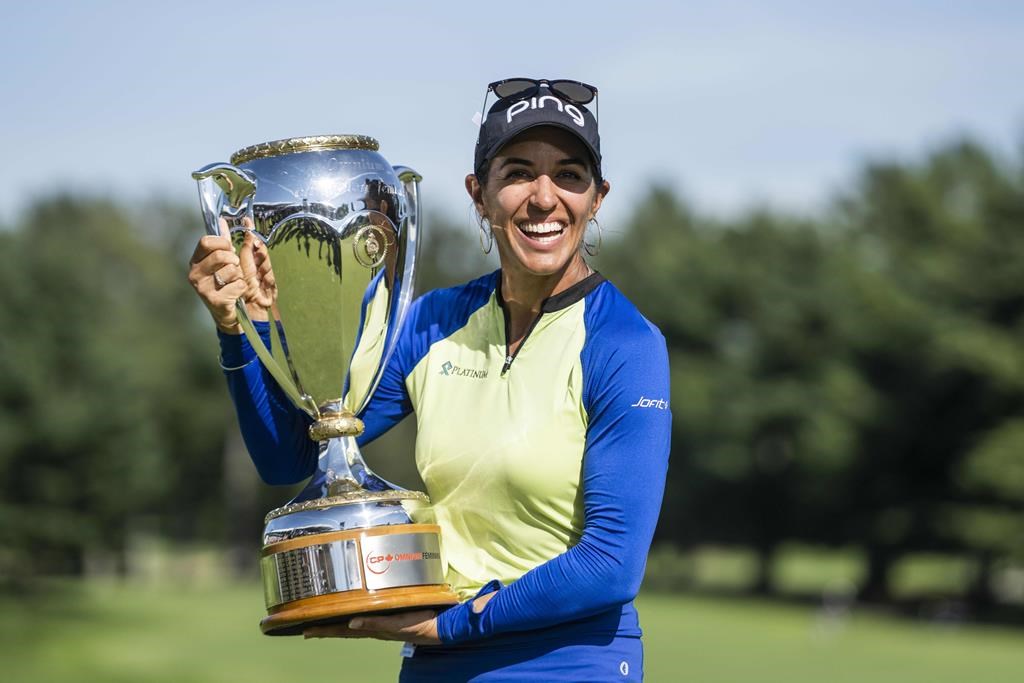 Paula Reto of South Africa holds the trophy after winning the CP Women's Open in Ottawa, on Sunday, Aug. 28, 2022.