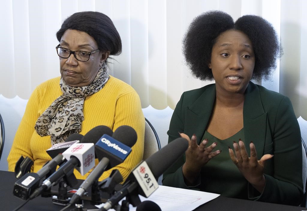Lawyer Marie-Livia Beauge, right, speaks to the media as Mireille Bence, whose son Jean-Rene Jr. Olivier was shot shot dead by police in 2021, looks on during a news conference in Repentigny, Que., Tuesday, Feb. 28, 2023. Bence is suing the City of Repentigny for wrongful death. 