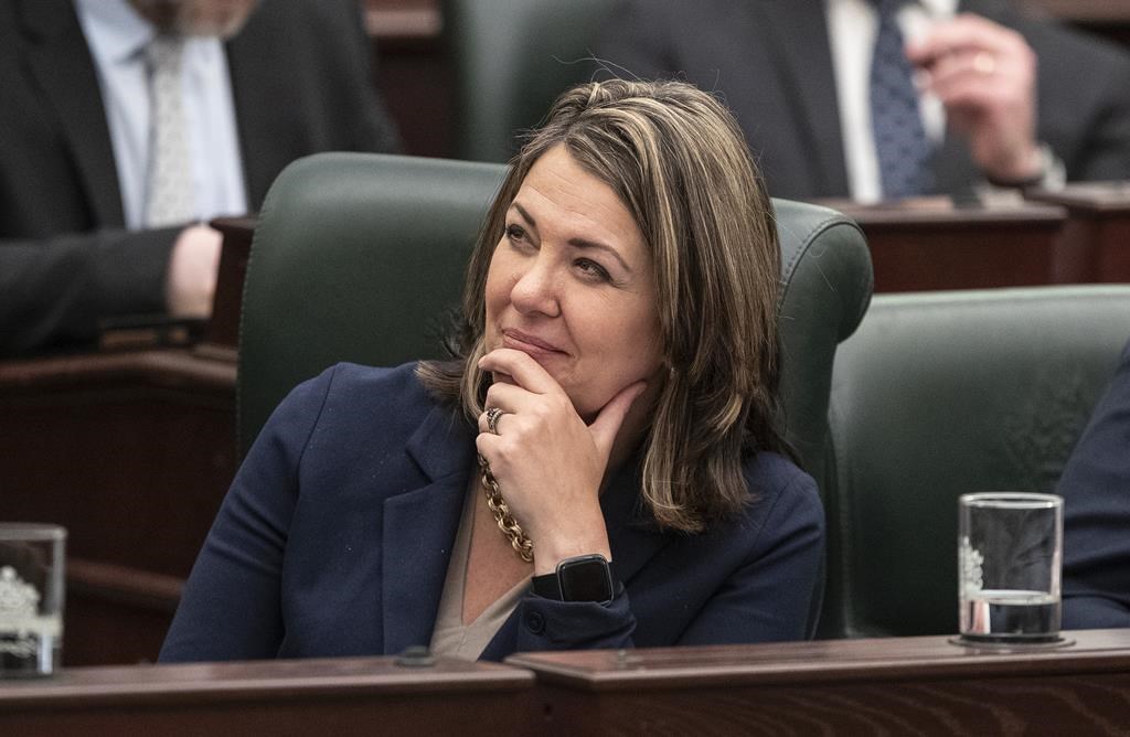 Alberta Premier Danielle Smith watches as Finance Minister Travis Toews delivers the 2023 budget, in Edmonton on Tuesday, Feb. 28, 2023. THE CANADIAN PRESS/Jason Franson .