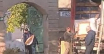 Image from citizen video showing Russians looting Kherson art museum, November 2022.