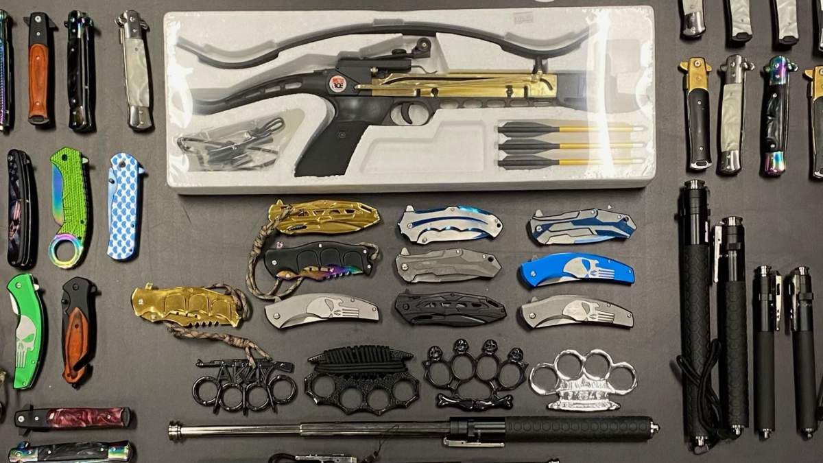 Halton police show off some 80-plus prohibited weapons that were being sold at a convenience store in Burlington, Ont.