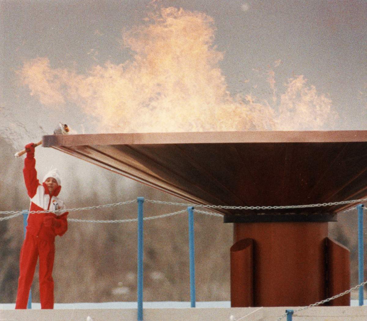 The Olympic flame burns bright over Calgary’s McMahon Stadium Saturday, Feb. 13, 1988, after 12-year-old Robyn Perry, a novice figure skater from Calgary, held the torch aloft to light the massive cauldron and light the flame.