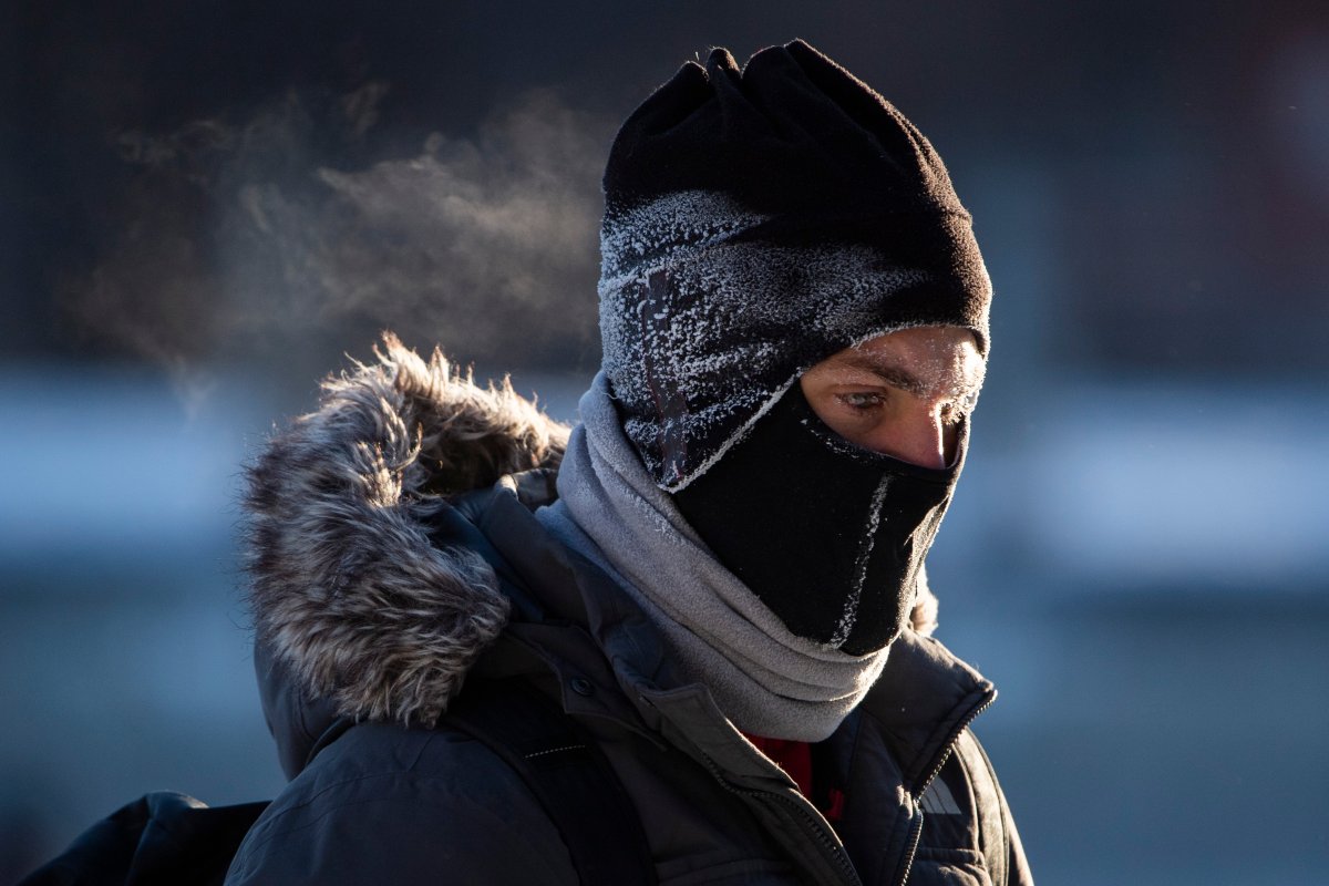 FILE - A skater’s face, toque and balaclava are covered in frost from their breath as they make their way along the Rideau Canal Skateway in Ottawa, on Saturday, Jan. 15, 2022.
