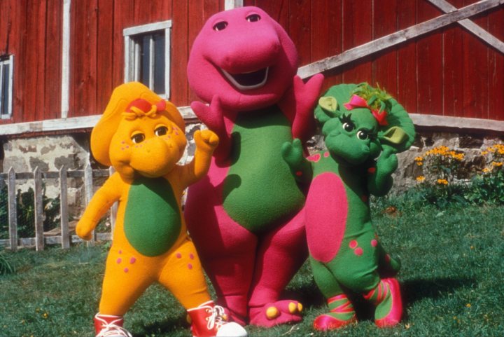Barney alongside BJ the yellow protoceratops and Baby Bop the green triceratops in 1998's 'Barney's Great Adventure.'