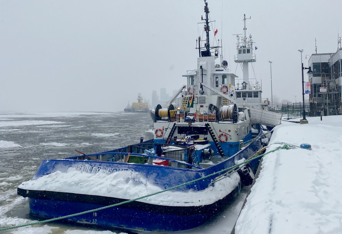 Two tugboats that have been detained by Transport Canada are shown in Trois-Rivières, Que. on Thursday, Feb. 2, 2023. Groups that advocate for seafarers are expressing concern for crew members who are spending a harsh Quebec winter aboard three tugboats that have been stuck in the port of Trois-Rivières for months.