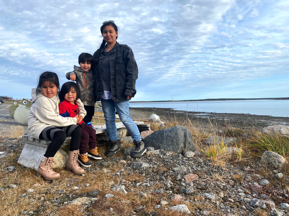 Heather House and her children are seen in Chisasibi, near the James Bay region, Quebec on October 23, 2022. 