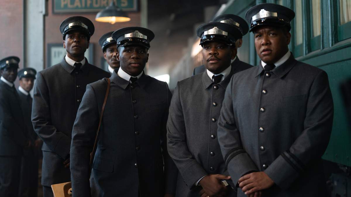 Actors Ronnie Rowe (left), Jr. as Zeke and Aml Ameen (second right) as Junior and other cast members are shown in a scene from 'The Porter.'