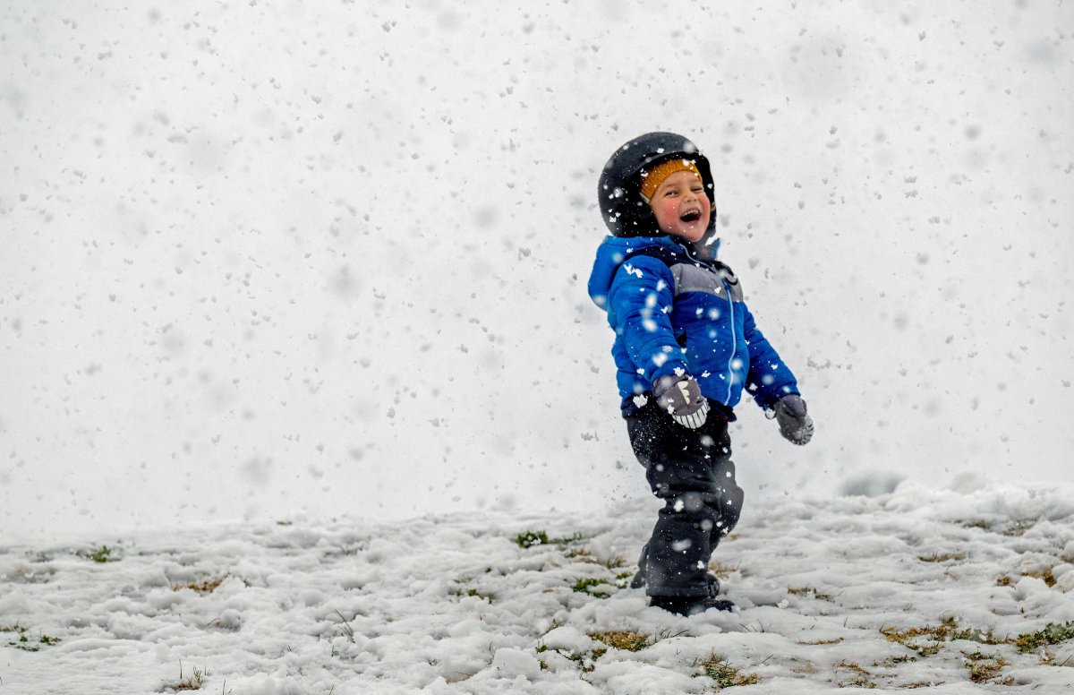 Kamal Rahm, 3, enjoys the snow at Yucaipa Community Park, about 90 minutes east of Los Angeles, on Thursday, Feb. 23, 2023.