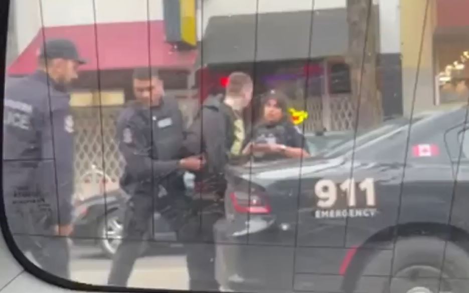 A man is taken into custody following a shooting in Vancouver's Downtown Eastside on Feb. 20. 