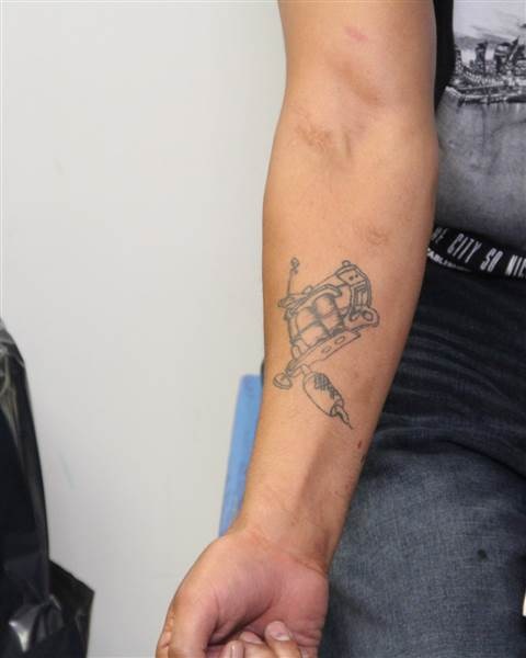 Tattoos on the right arm of Edmonton homicide suspect Donn Austin Gauthier.