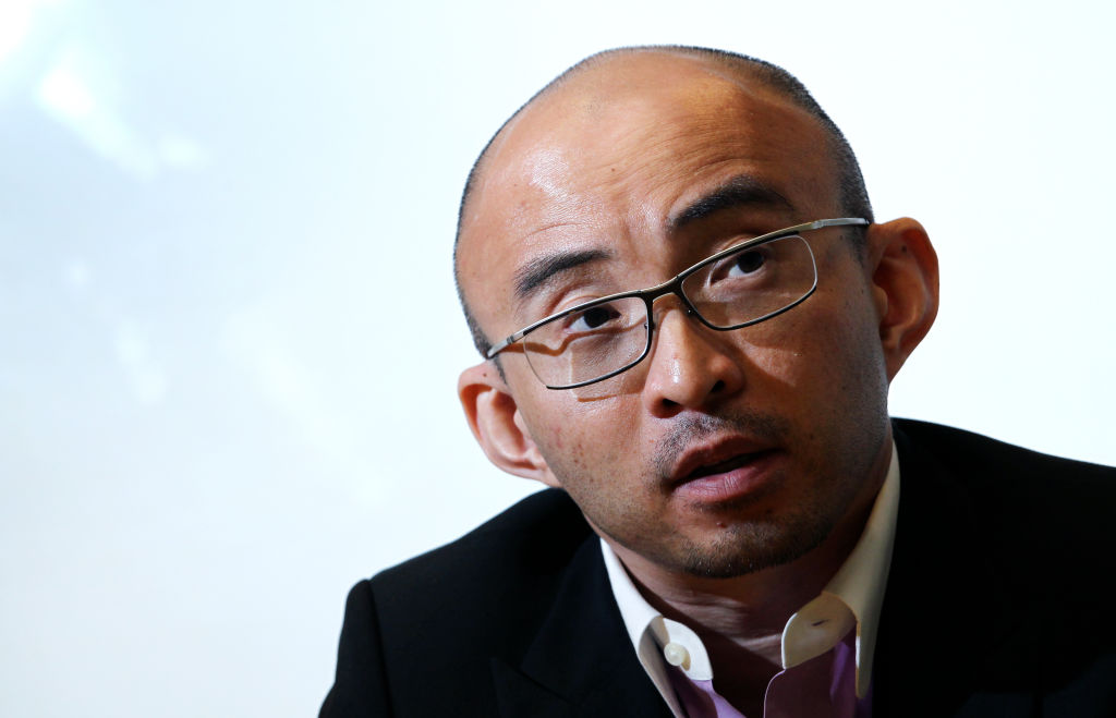 File - Fan Bao, CEO of China Renaissance Securities Limited, poses for photographer at SCMP office in Causeway Bay.