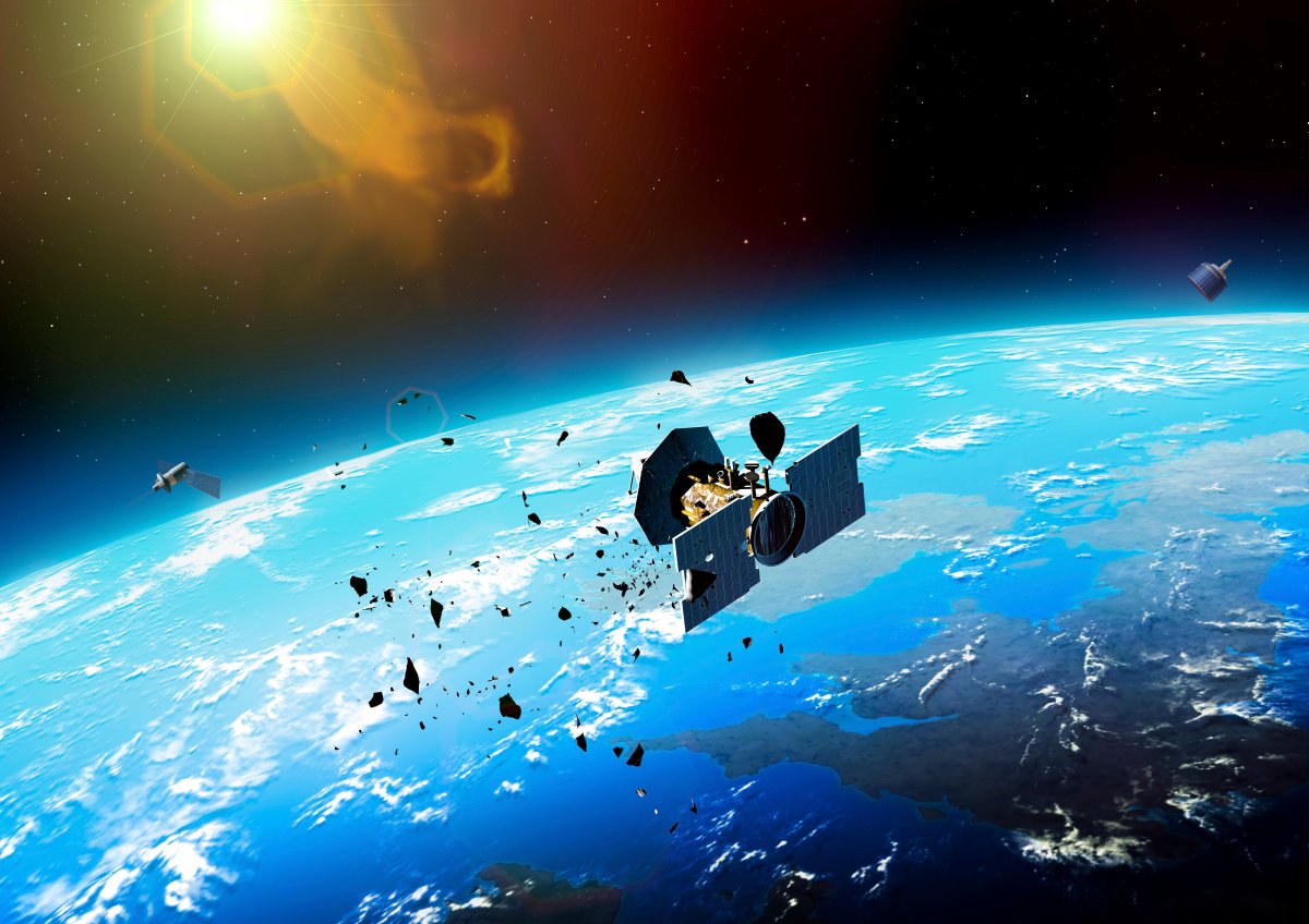 An artistic rendering of a satellite damaged by an impact with debris.