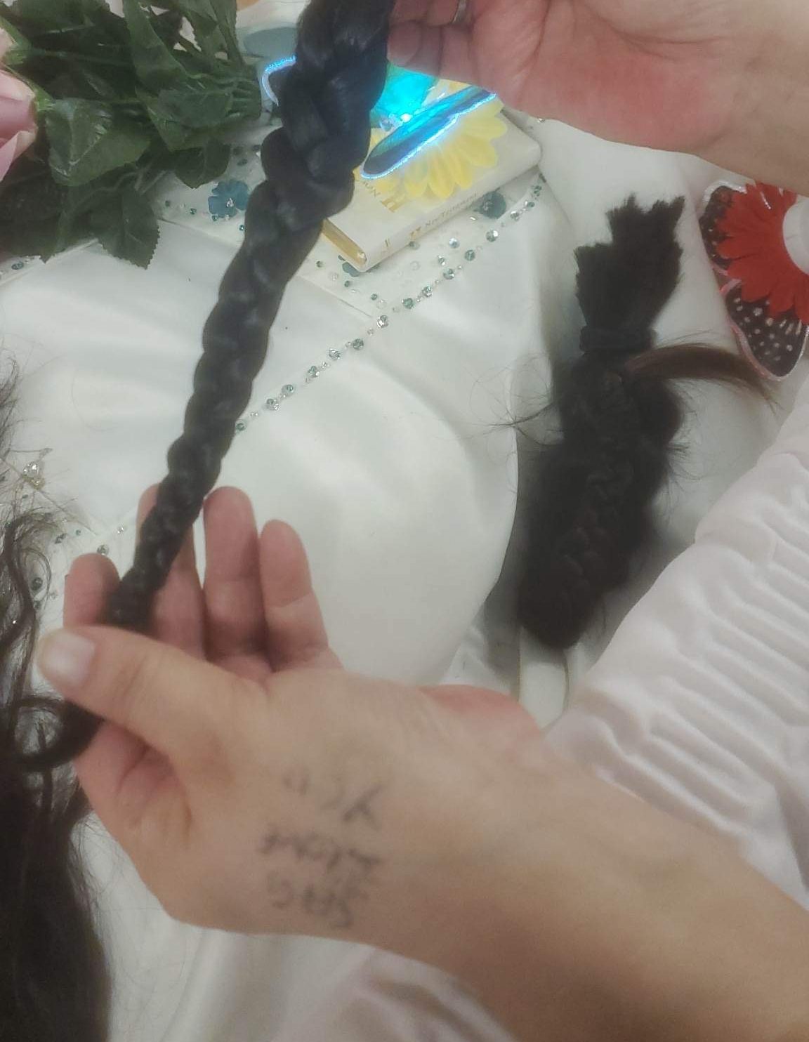 In Anishinaabe custom, some cut their braids to be buried with her. Image submitted to Global News.