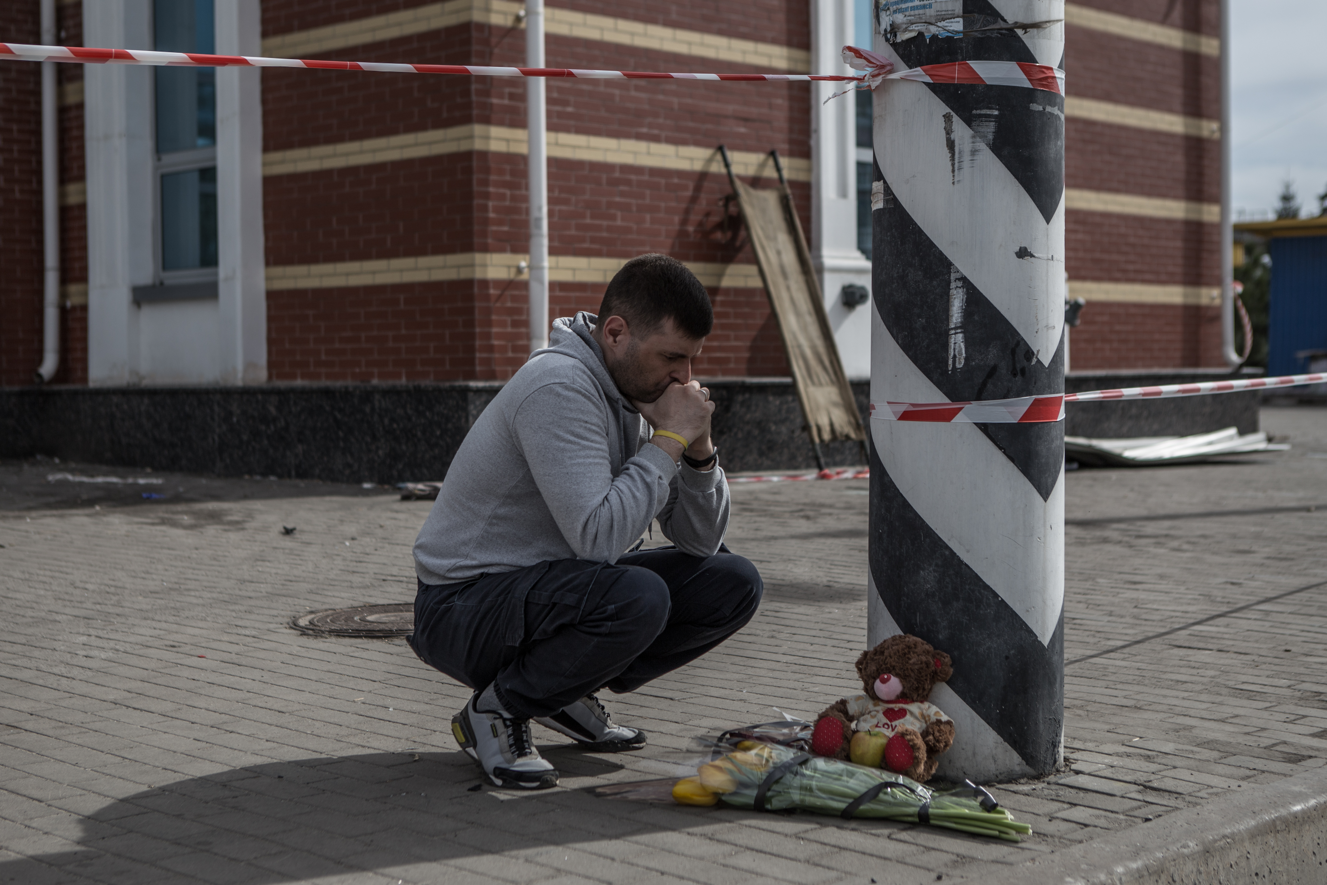 A man mourns the victims of a Russian attack on Kramatorsk station.