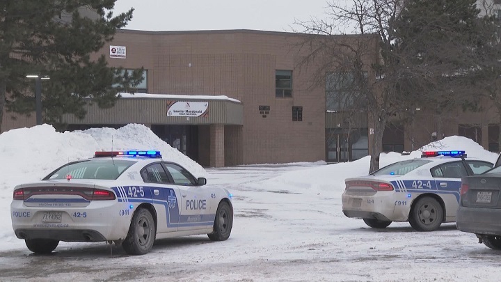 Police searched school grounds both inside and outside during a lockdown prompted by a threat directed at Laurier Macdonald High School. Tuesday, Feb. 7, 2023.