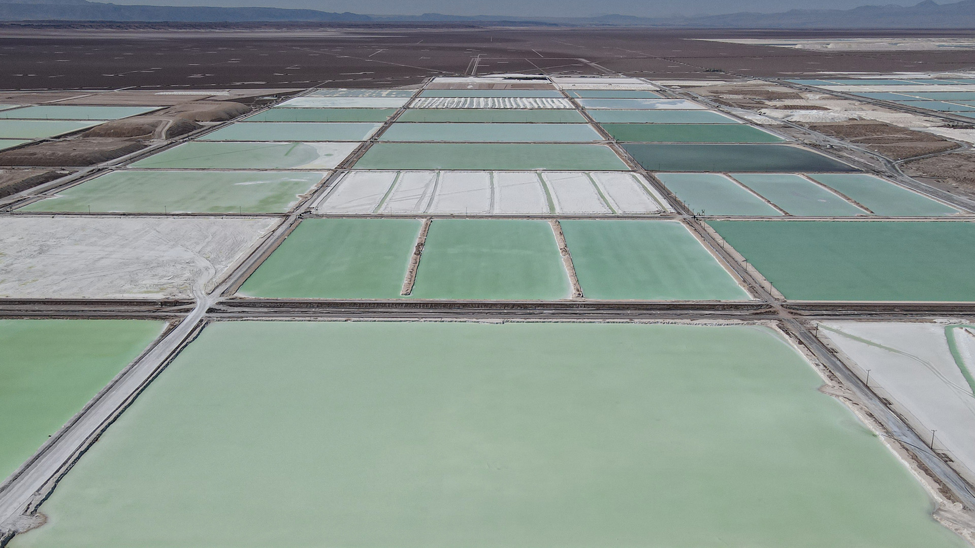 Huge pools of brine containing lithium carbonate and mounds of salt by-products stretch across a lithium mine in the Atacama Desert. Chile is the world’s second-largest producer of lithium after Australia.