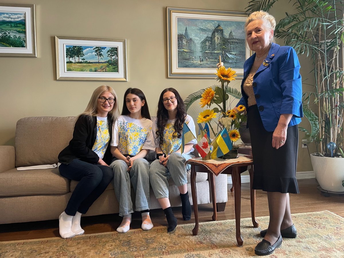 Bozehena Melnychuk, middle left, and Marta Kosar, middle right, are living in London, Ont., due to the Russian invasion of Ukraine. Posing with them are their aunt Sofiya Mertsalo, left, and president of the London chapter of the Ukrainian Canadian Congress Daria Hryckiw, right, on Feb. 23, 2023.