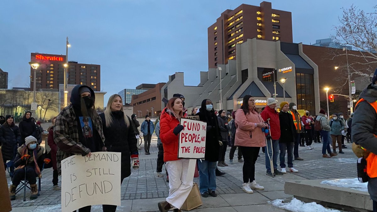 Demonstrators out front of the Hamilton, Ont. city hall forecourt on Feb. 6, 2023 protesting a proposed police budget hike.