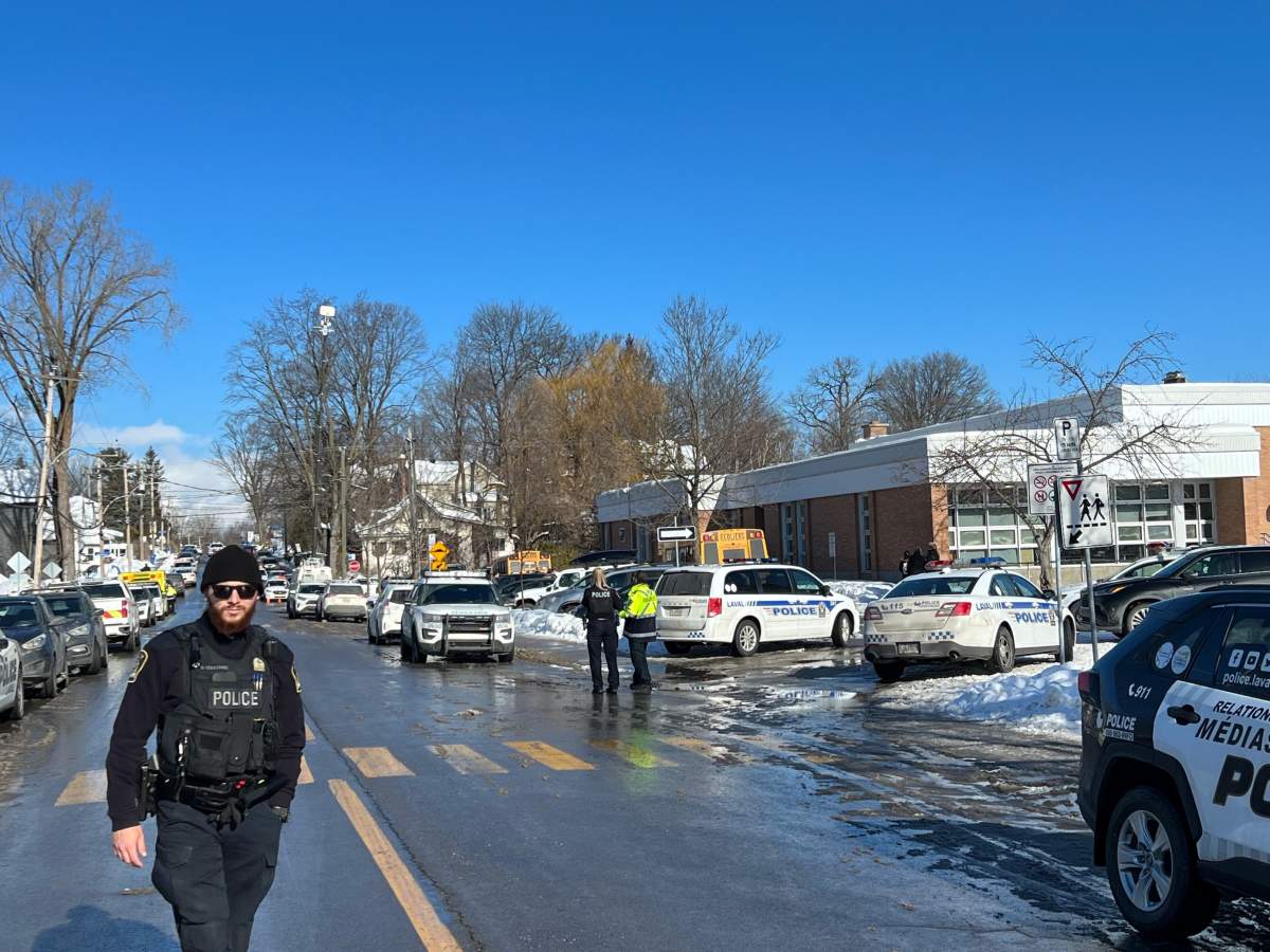 Laval police on the scene after a bus crashed into a daycare early Wednesday, Feb. 8, 2023.