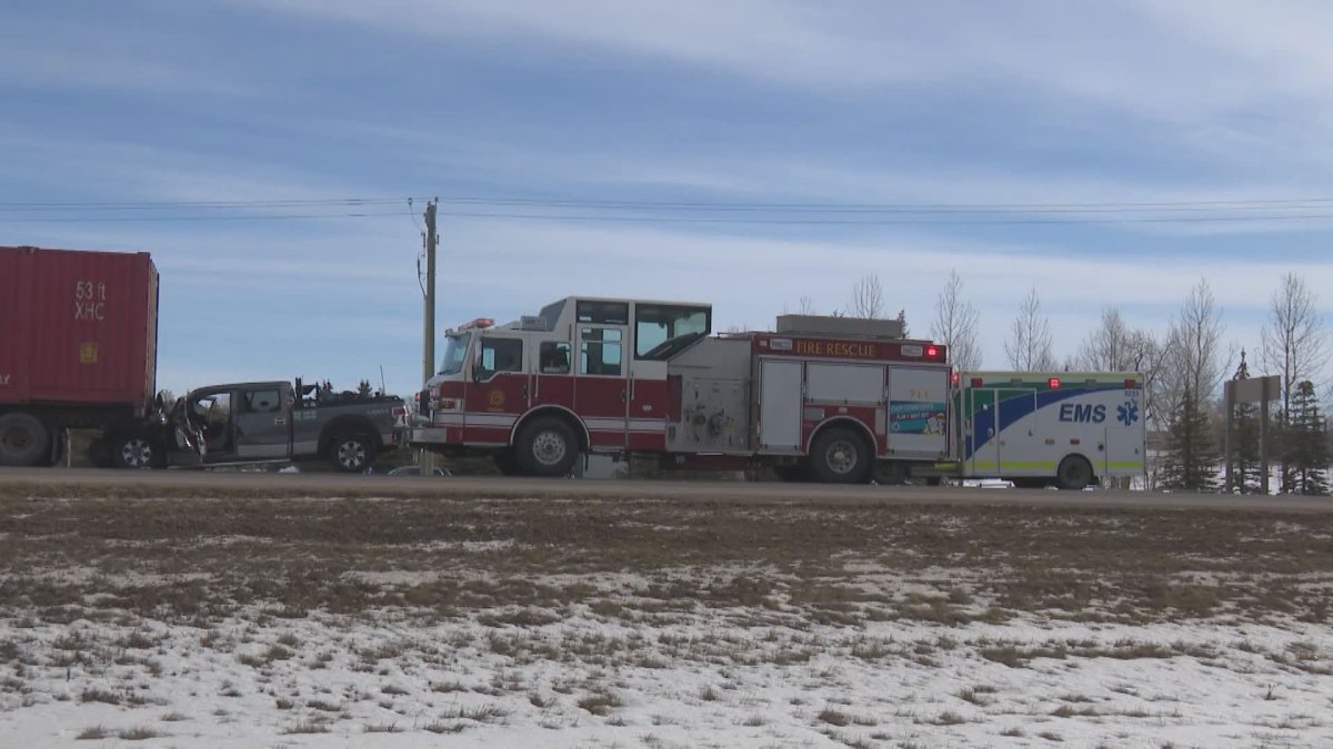 Emergency crews attend a crash near Okotoks, Alta., on Feb. 9, 2023.