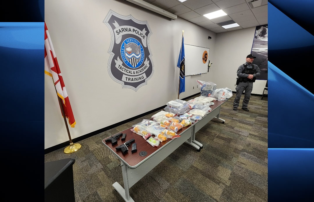 Sarnia police display the drugs and weapons seized following a joint operation that culminated in two separate searches being carried out in London, Ont.