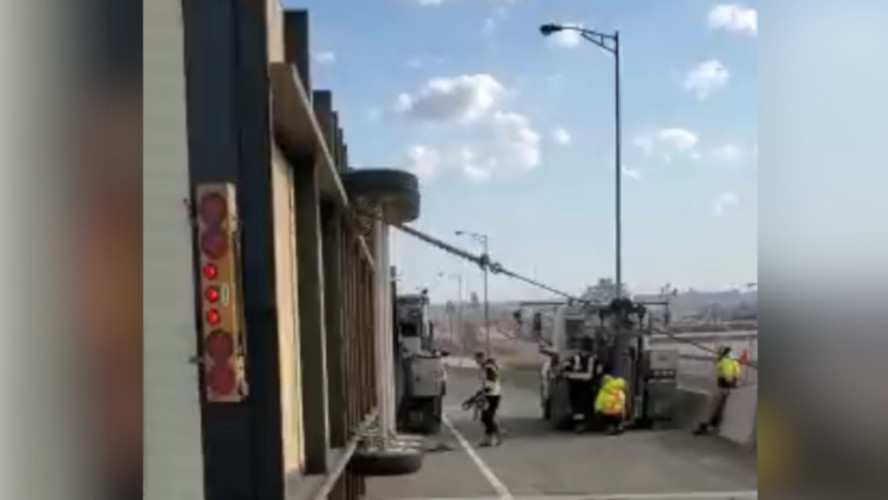 High winds on the Niagara-bound QEW knocked over a transport truck on the Burlington Skyway Feb. 15, 2023.