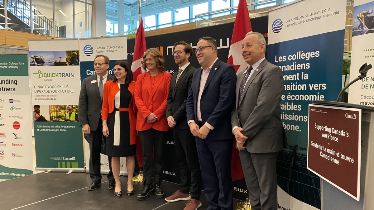 Ron McKerlie, Filomena Tassi, Lisa Hepfner, Corey Diamond, Dan Muys, and Paul Armstrong pose at the launch of Quick Train Canada at Mohawk College.