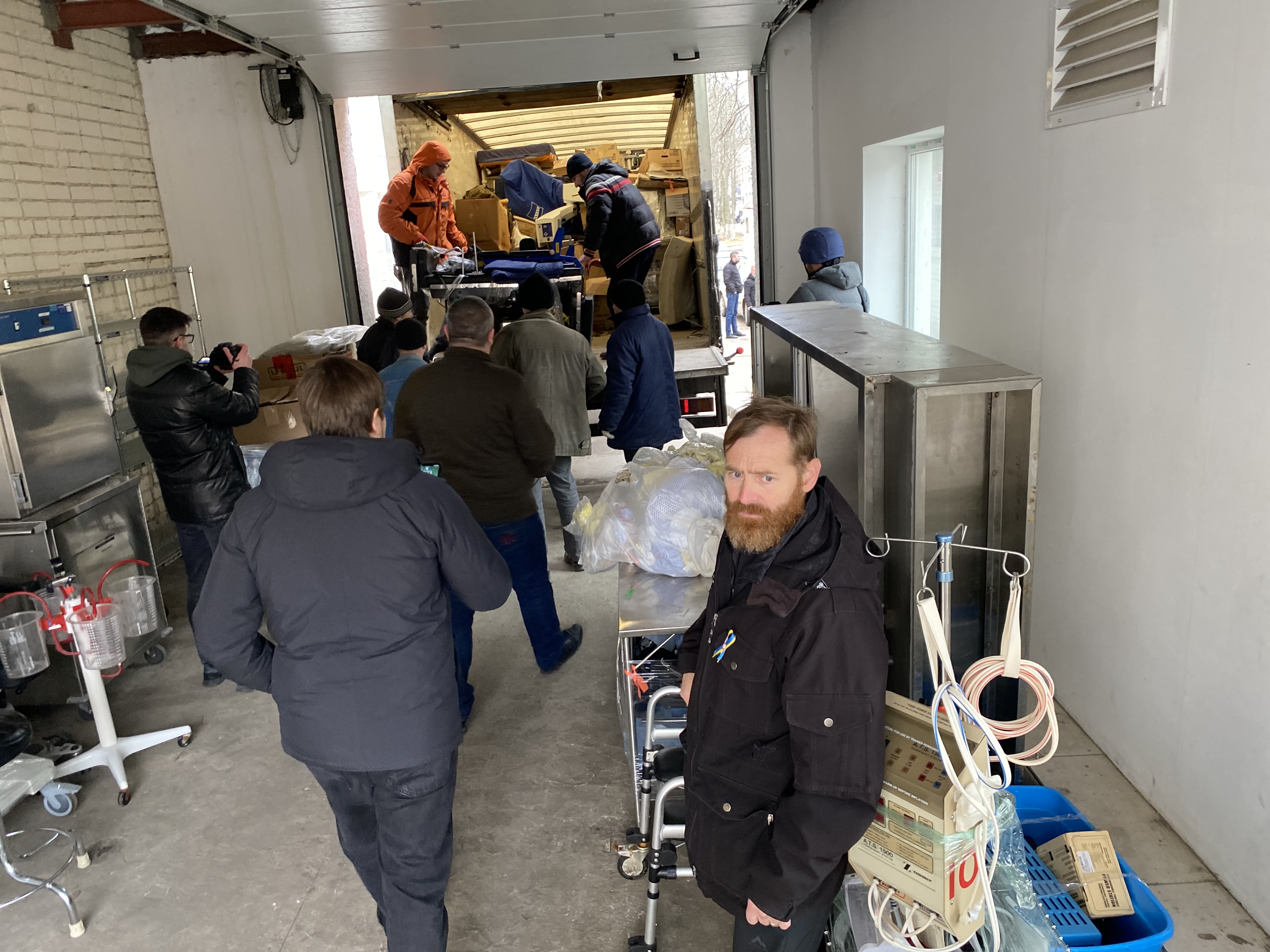 Canadian military veteran Rob McTavish, right, delivers a truckload of medical equipment to Marhanets hospital, Jan. 24, 2023.